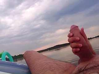 My wife jerks off my dick with a happy ending in the inflatable boat on the lake