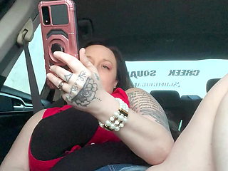 Horny slut watching porn using dildo In car while driving down the road