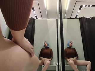 Masturbation in a fitting room without a door. Horny blonde gets a strong orgasm in a public place