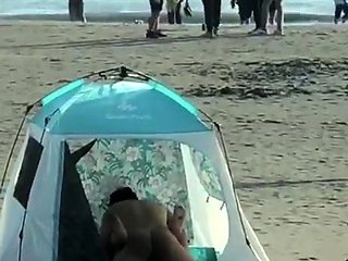 Beach voyeur films husband and wife having sex in a tent