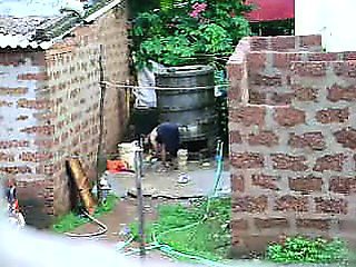 Watch this two hot Sri Lankan lady getting bath in outdoor