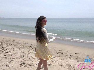 Tattooed brunette Angel Windell gets fucked on the beach