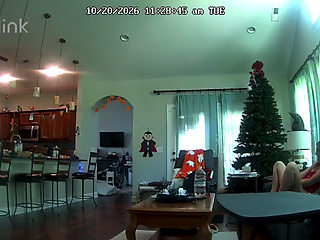 Camera catches MILF playing with pussy on couch