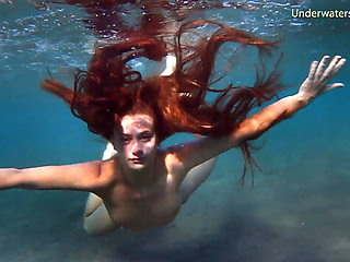 Enjoy a redhead underwater and lesbians