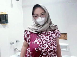 Fountain of a girl in a batik daster dress