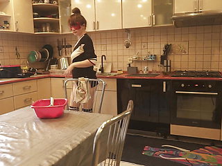 Sexy Dressed Wife Preparing Food in the Kitchen