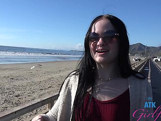 Beautiful brunette Imani Valor has glasses and long hair while having sex outside.
