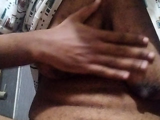 Busty Indian babe playing with her boobs and pussy while peeing