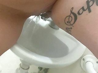 Pissing in the work sink and playing with it