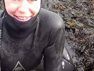 Rubbery Beach Encounter: Lucy's Neoprene Pussy Play with Stranger