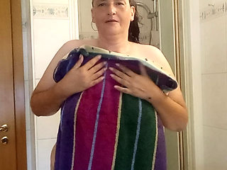 Mature German MILF 52 showers a chubby body under the shower