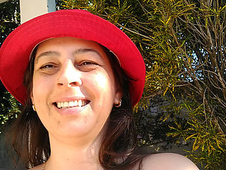 My wife is masturbating naked in the front yard.