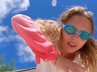 Skinny blonde ukrainian teen Clarise reveals her small tits in the pool