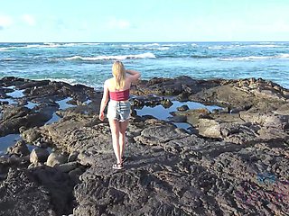 Natural blonde Melody Marks strips down to pose nude on the beach