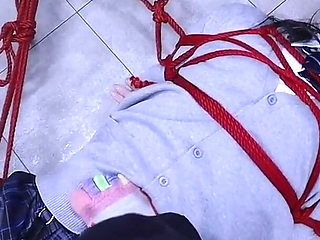 The Lovely Girlfriend Is Bound by Gloves, a Collar, and a Gag