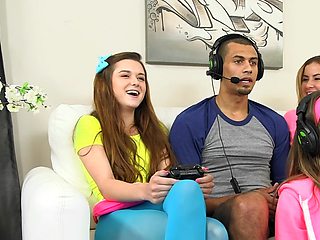 Three teen babes seduce a gamer and suck his huge dick