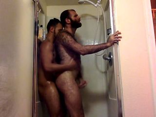 Two hairy guys fuck in the shower