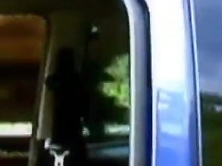 A horny young couple has sex in a car in the middle of nature