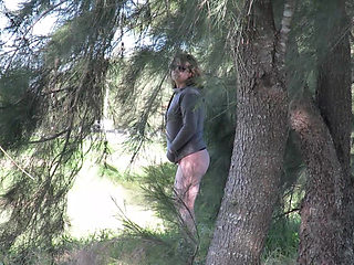 Patricia and her ass walks among the pines