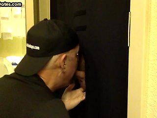 Gloryhole amateur DILF sucks and wanks BFs penis at home
