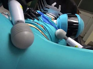 Wearing a helmet while few people use toys on her