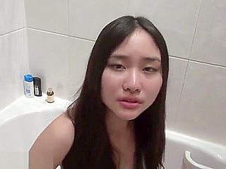Japanese beauty gets fucked in a hot tub