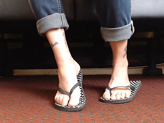 Dotted flipflop shoe play closeup