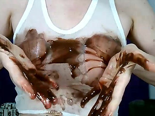 Wetting boobs, tities and nipples with chocolate