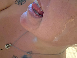 Sucking his cock until he explodes all over her face