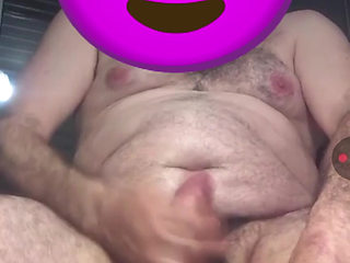 Handsome chubby guy with big fat cock riding huge dildo all the way in close-up