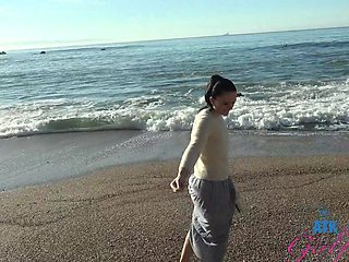 Beautiful brunette Imani Valor in hot glasses having sex on the beach.