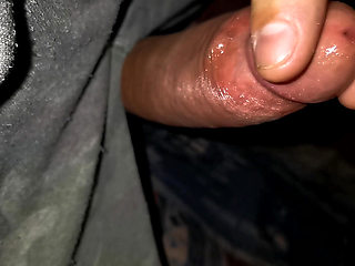 Playing with the head of a wet penis