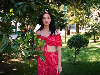 Sultry Brunette in Red Dress Smoking Rolled Cigarette