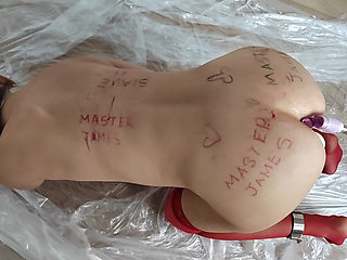 The female slave is bent over for her master's pleasure.