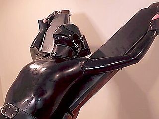 Latex Servitude Floozy Is Made To Have Multiple Orgasms On A Cross