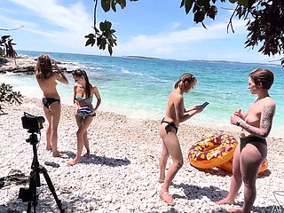 Two hot lesbians Rebeka Ruby and Miss Pussycat are having fun on the beach.