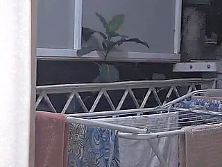 Naughty Housewife Showing off to Passers-by While Her Husband Works