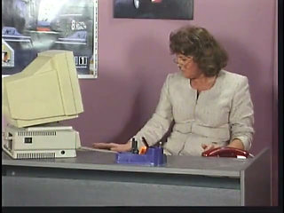 Mature brunette sucks and takes cock by desk at work