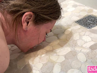 Submissive slut drinking piss from bathroom floor after sex