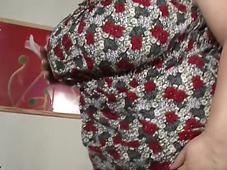 Monster boob mature plays with a big dildo