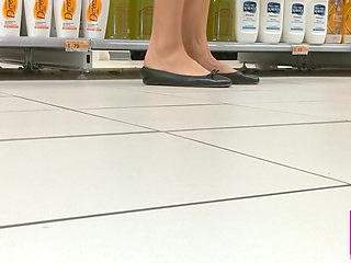 Footplay and Dipping in Black Flats at a Conad Store