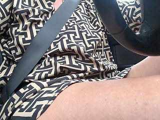 Elegant sexy stepmom drives cheerfully to work in the morning