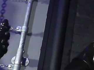 Lady Valeska and Miss Patricia have their sub over a bench.