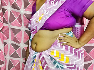 A beautiful Tamil wife, tying a sexy saree, arouses lust and leaves for work.