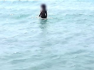 she walks naked on a public beach while her stepfather records a video.