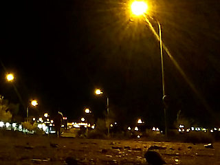 Naked on a quiet street at night