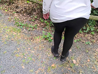 Whipping her bare ass on the barbecue area