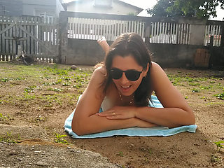 Wife sunbathing naked in front yard