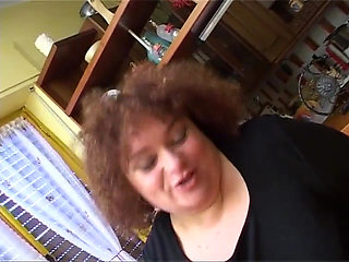 Italian bbw enjoys a big dildo in her fat and hairy pussy