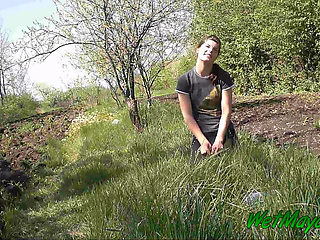 Pissing in grass on the side of the road